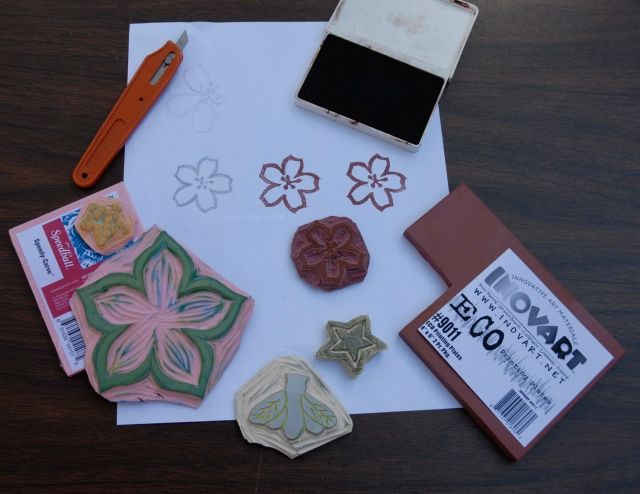 rubber stamps, custom carved stamps, and found objects can all be used to imprint designs into clay.