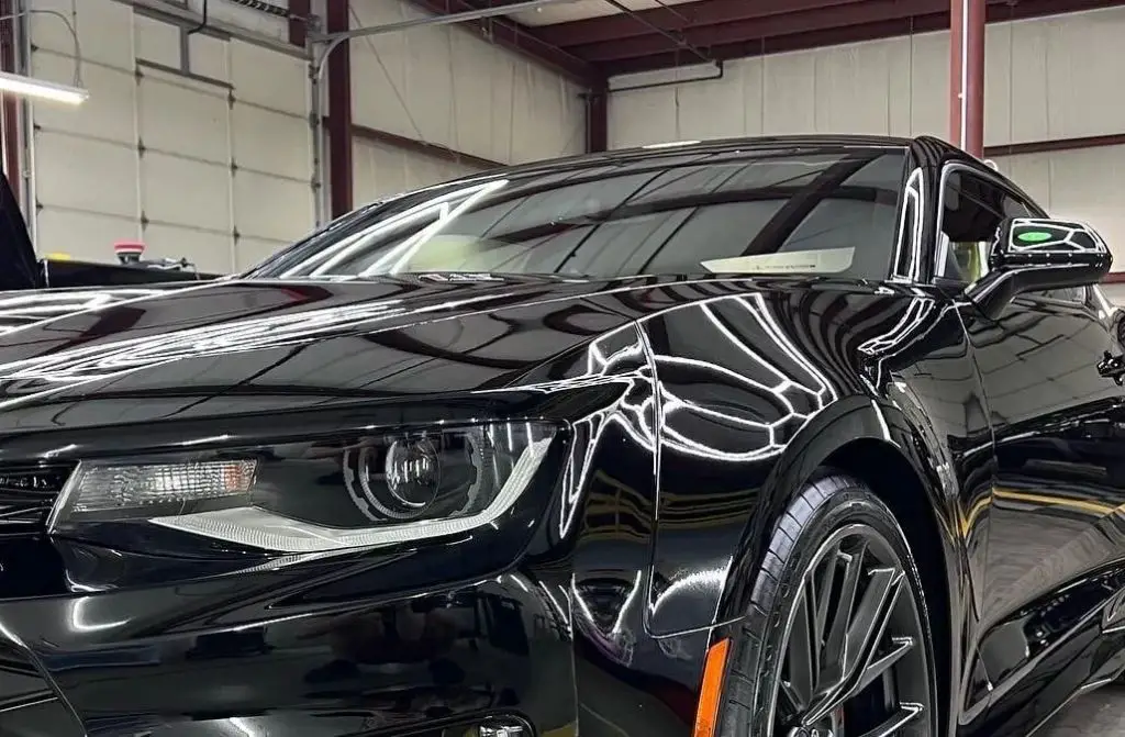 shiny black luxury sedan with ceramic coating