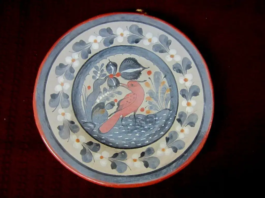 slipware plate with floral and bird motif