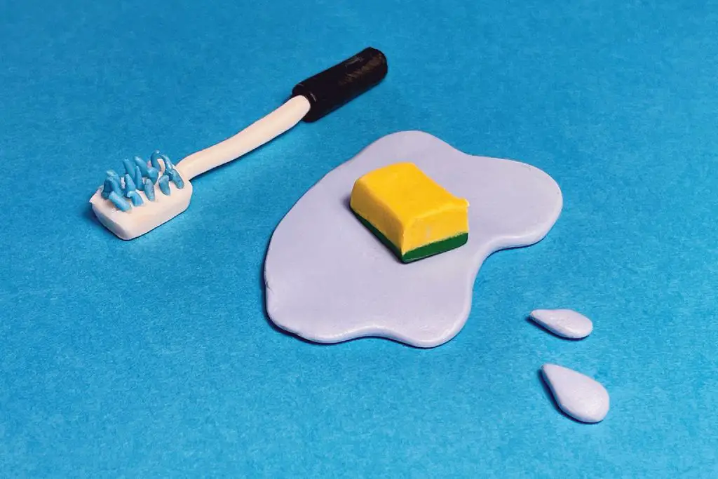 someone storing a kitchen sponge in a ceramic holder