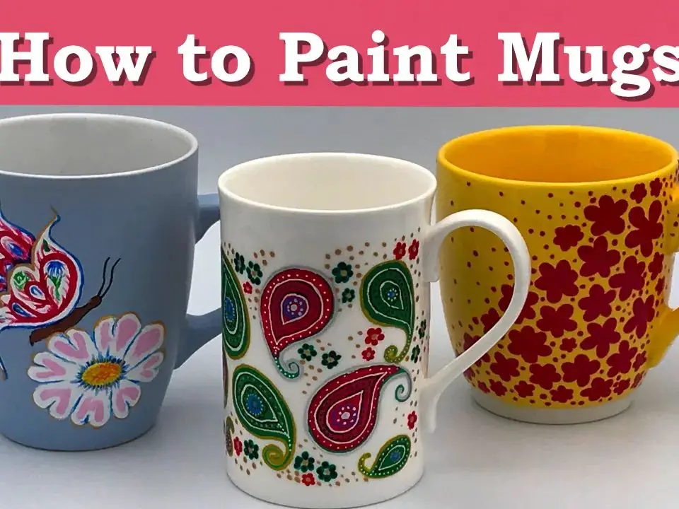 someone using a paintbrush to add details to a painted mug