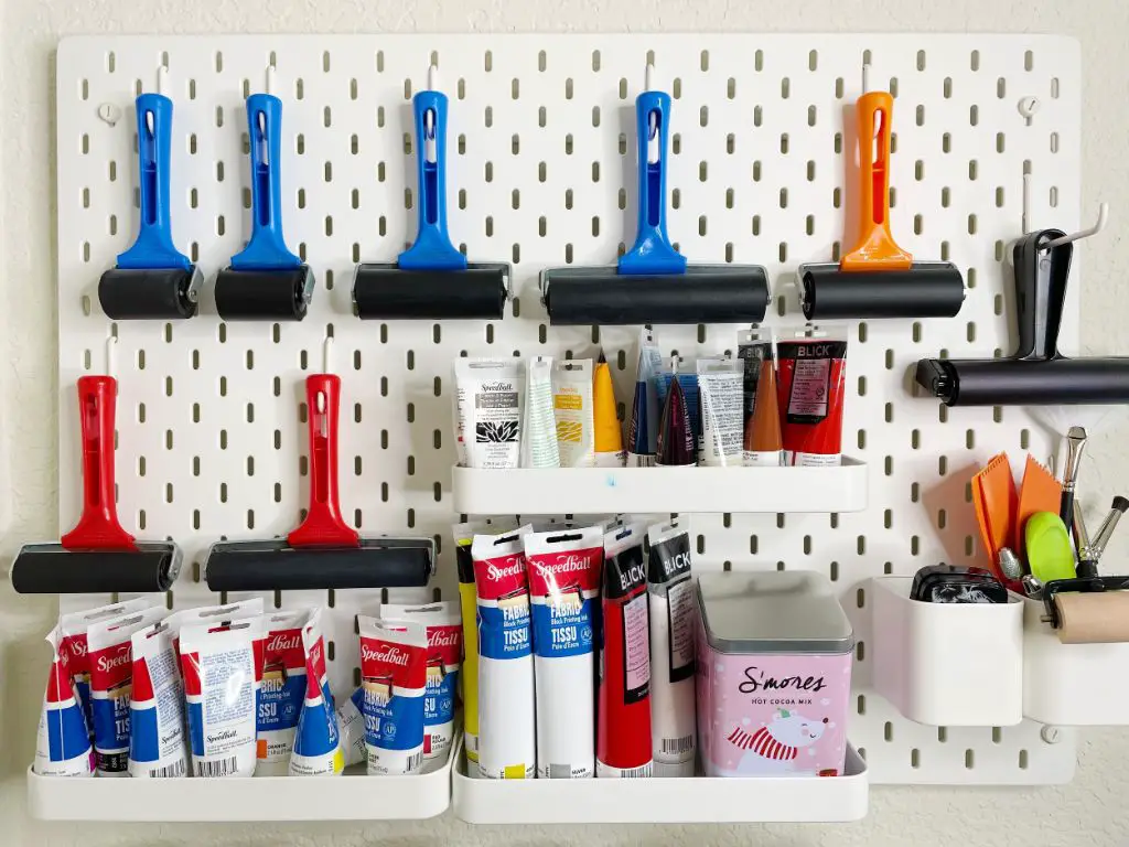 supplies organized on a studio shelf