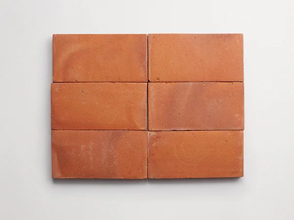 terracotta tiles are made from natural clay that is molded and then fired at high temperatures to harden and transform the clay into durable, long-lasting tile.