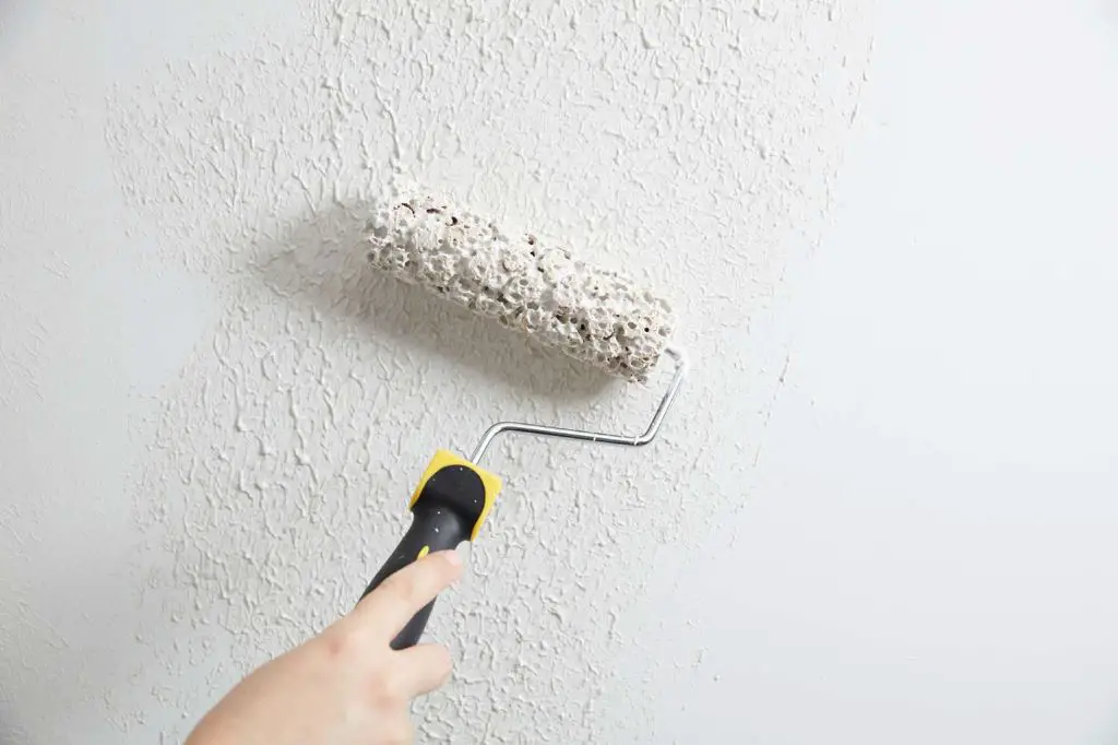 using a roller to apply texture allows more control compared to spraying texture.