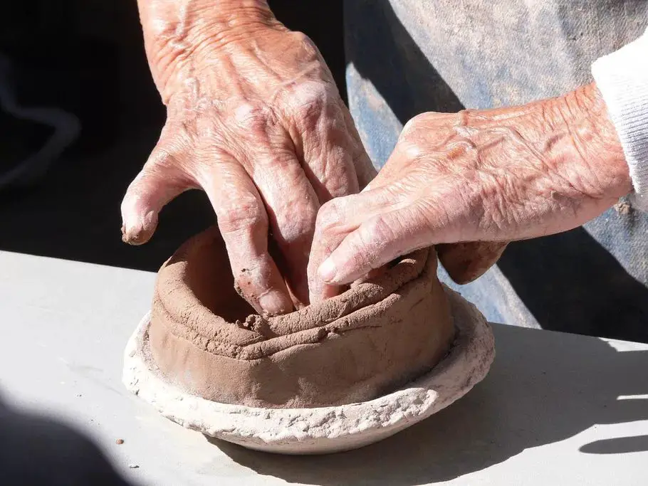 various sculpting techniques like pinching, coiling, and slab construction are used.
