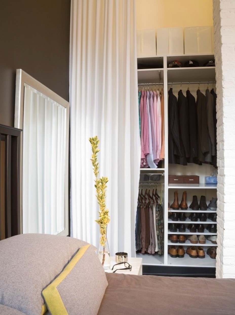 Contemporary closet design with white vertical curtain