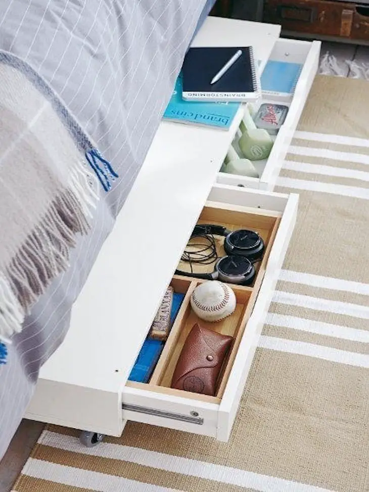 Add wheels to a wide drawer to have a storage space under the bed