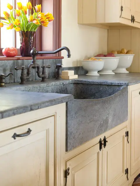 #26. Farmhouse sink with concrete countertops