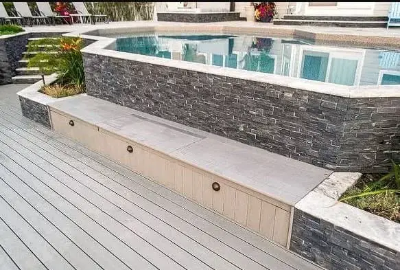 Large and expensive stone designed hot tub on a deck