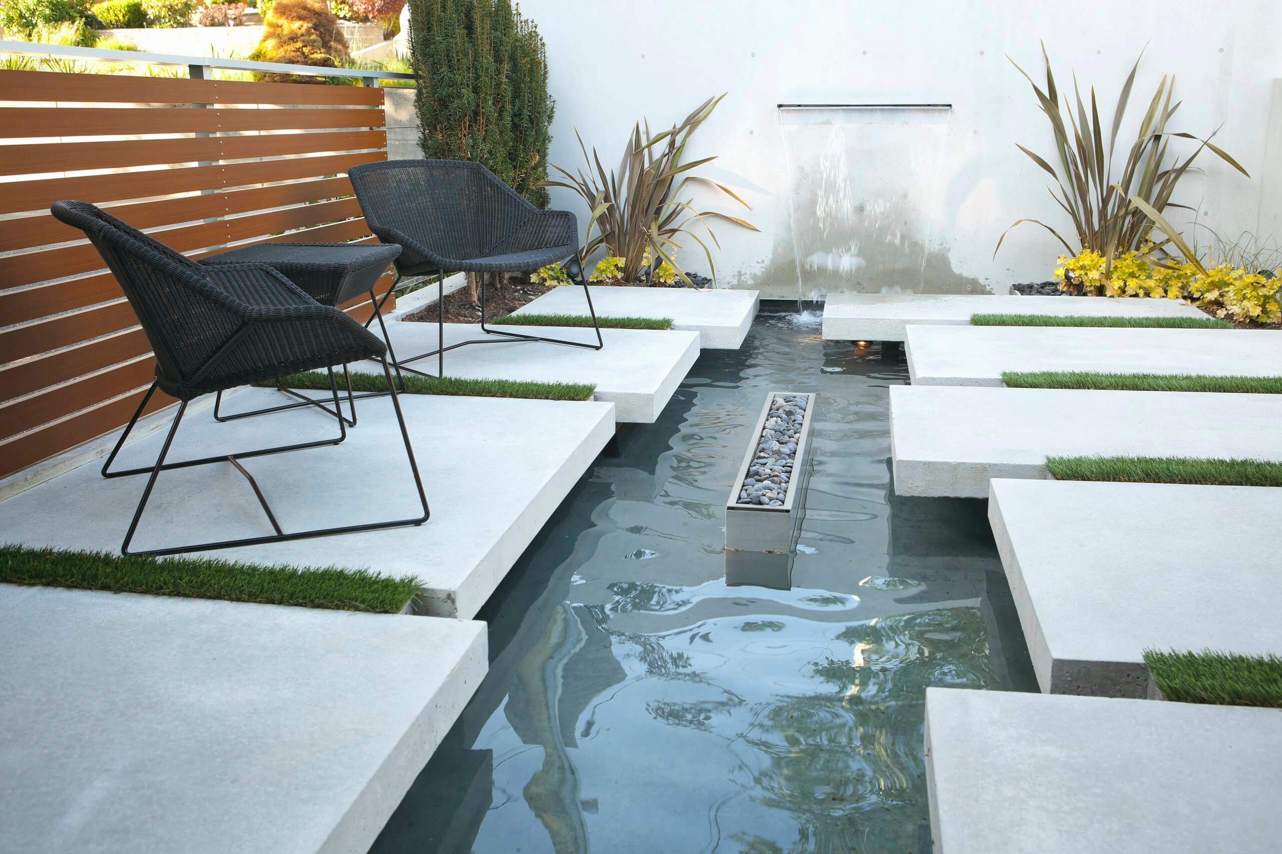 #13. Modern courtyard landscaping with a fire pit