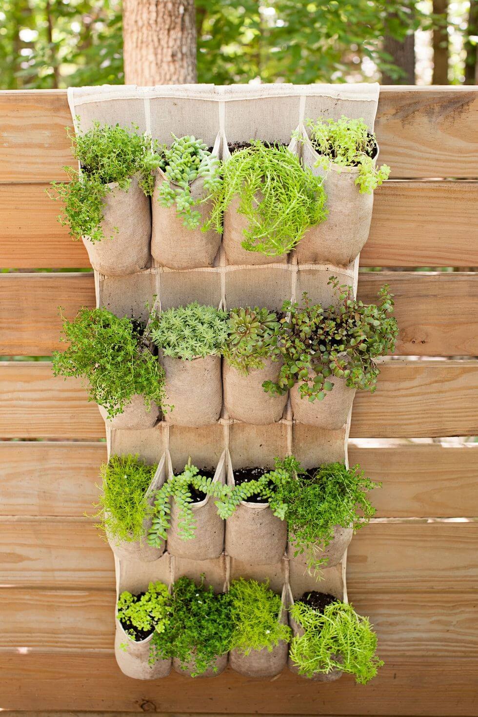 Hang an over-the-door shoe holder on the fence