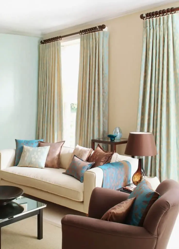 Pair drapes with patterned curtains for a unique look.