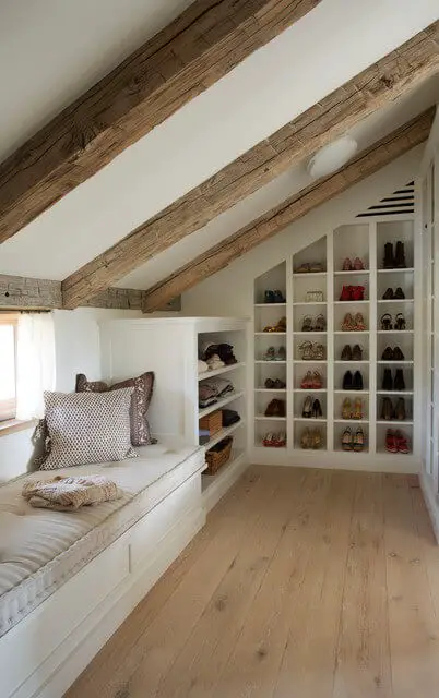 A cubical storage spaces for shoes along with the slanted wall