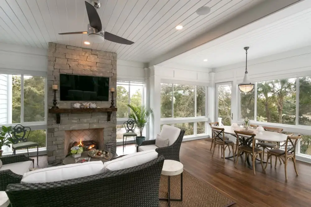 Screened in porch with fireplace and TV ideas.