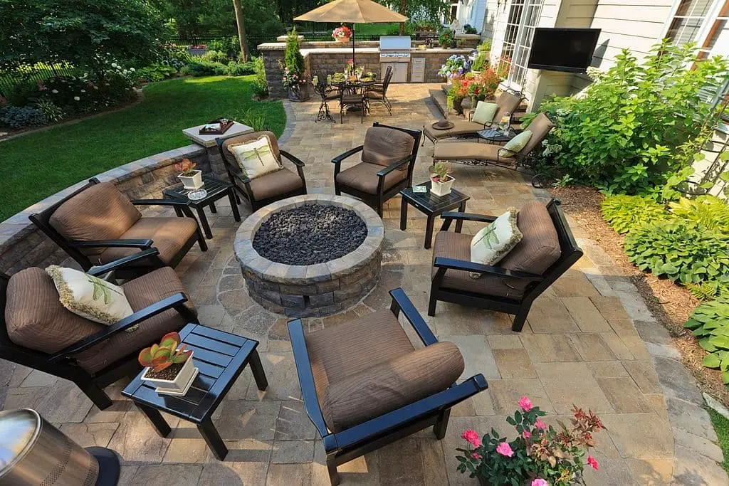 Backyard Oasis With Stone Patio and Fire Pit