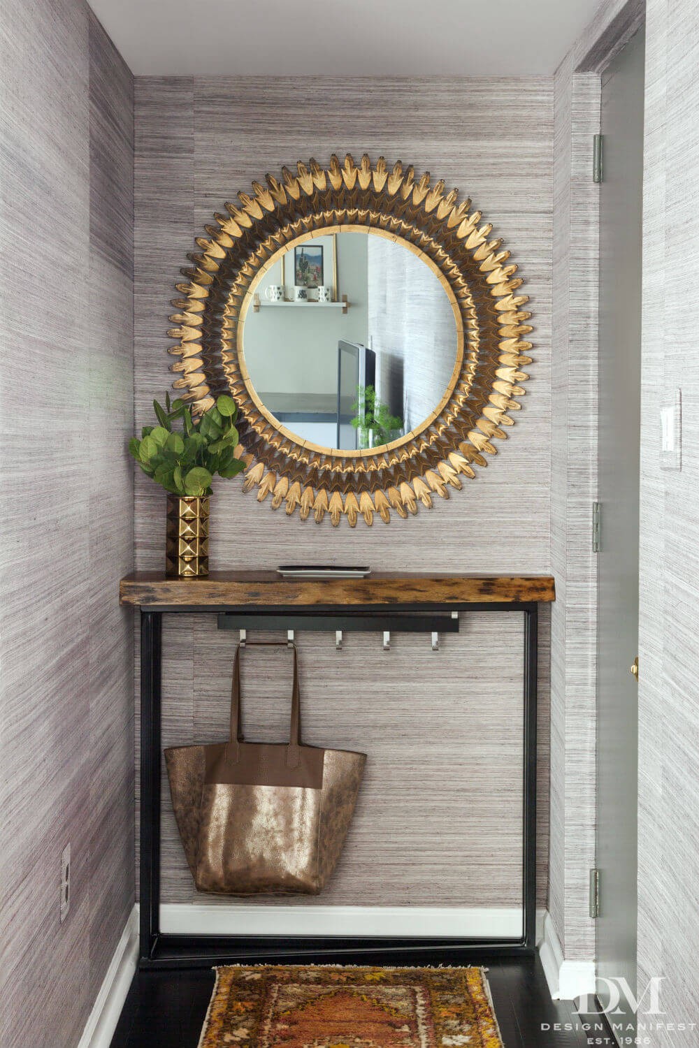 Sun mirror above console table