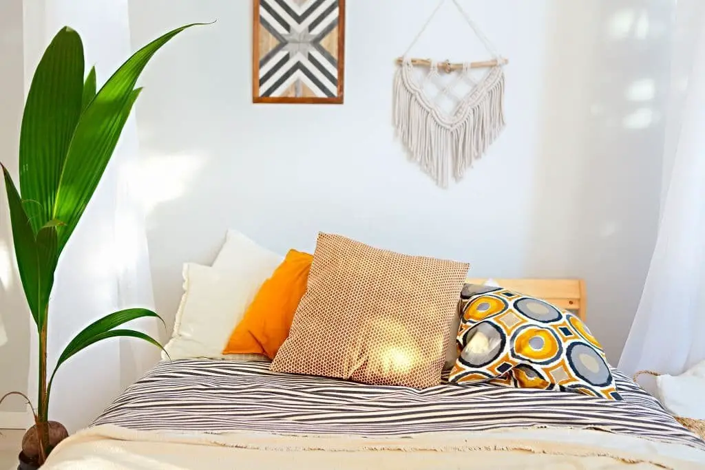 Bohemian themed gold and white bedroom