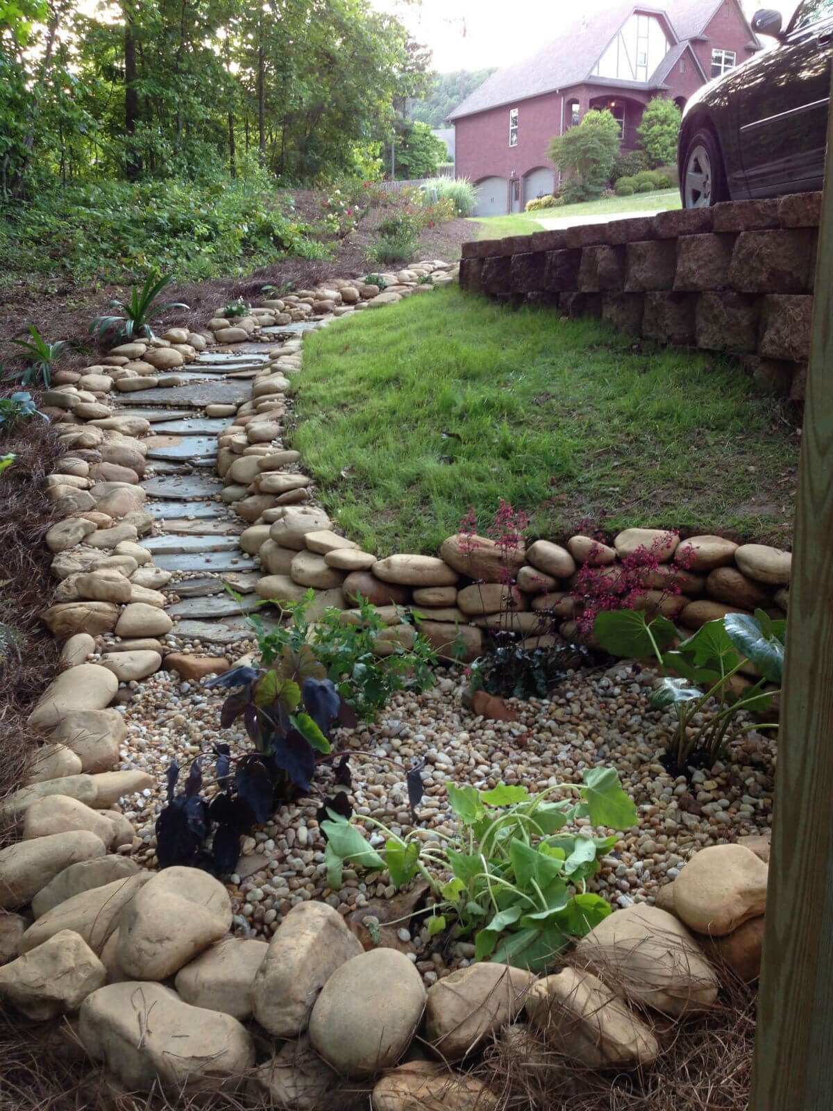 #9. dry creek bed that ends into a rain garden