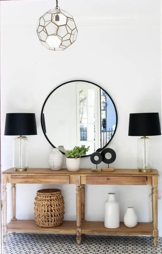 Round black mirror entryway