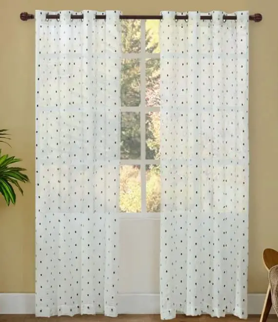 Electric blue walls and white and blue polka dotted curtains