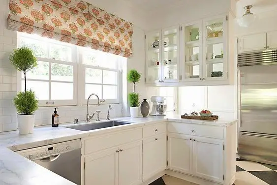 Glassy cabinet area on top of a kitchen peninsula