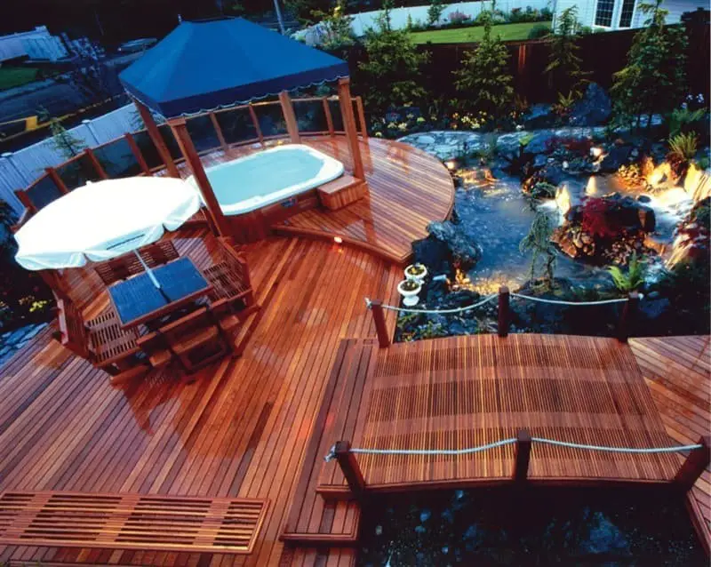 A hot tub with a pond across