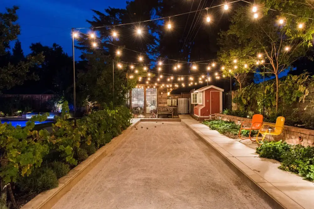 Backyard string light pole ideas.