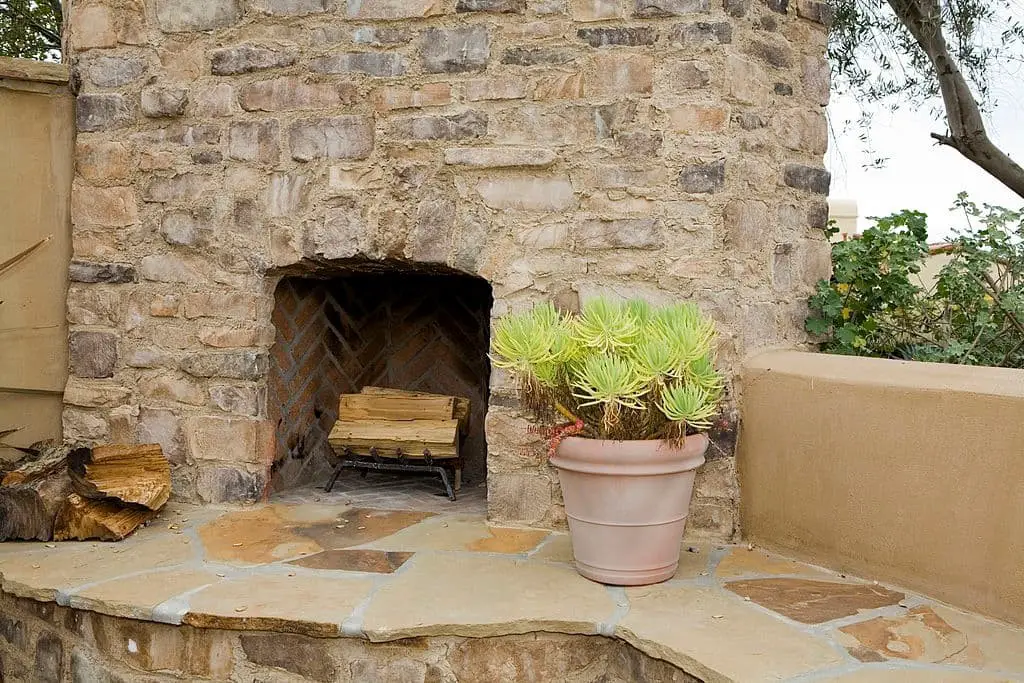 Backyard Oasis With Rock Fireplace