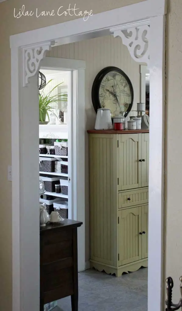 Simple plain wood and decorative brackets in the doorway.