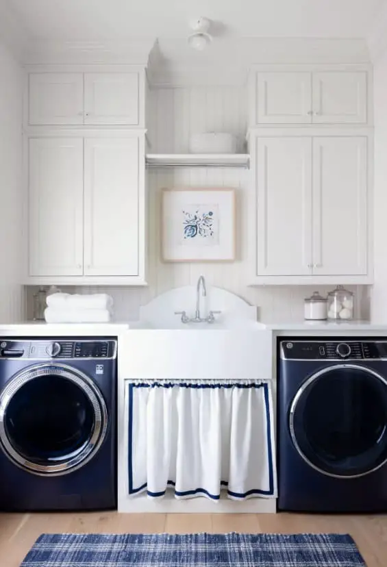 Laundry room ideas with sink between washer and dryer.