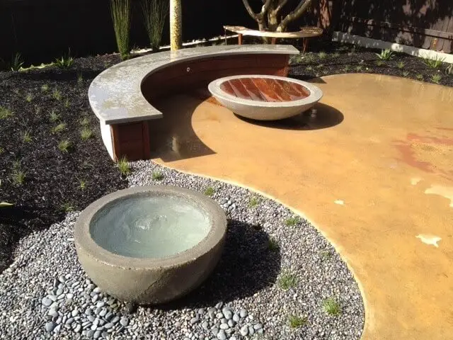 #15. Mid-sized minimalist backyard concrete patio fountain with no cover