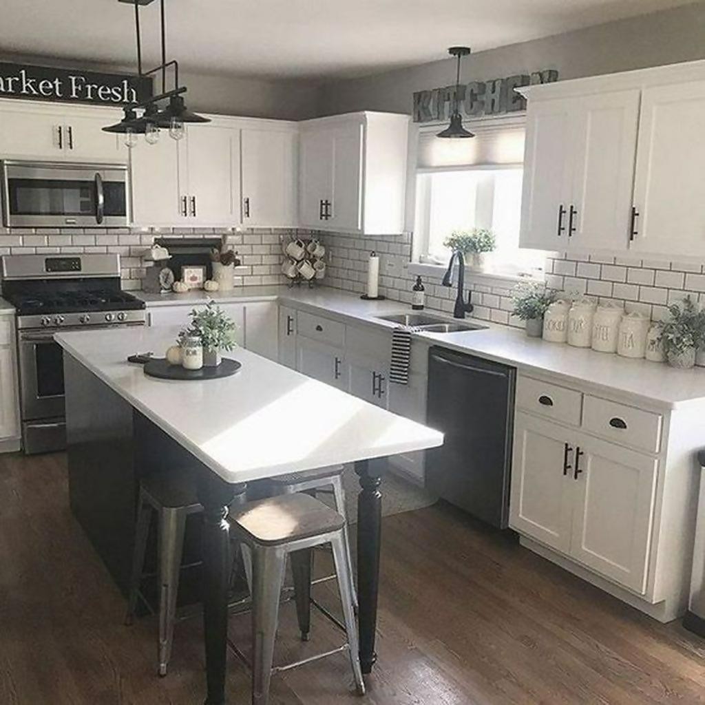 White cabinets and green accents