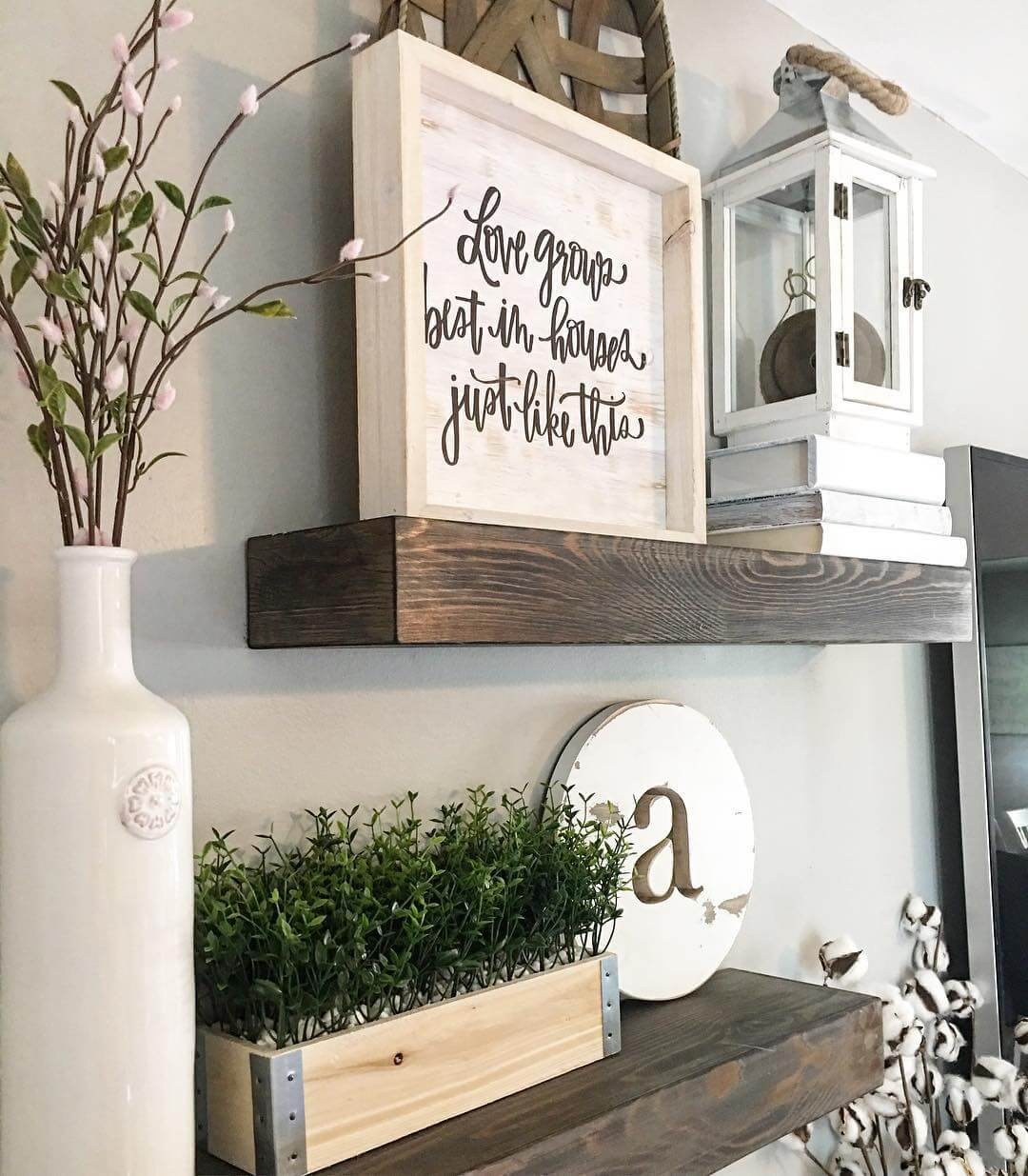 #10. Living room shelf with love grows sign