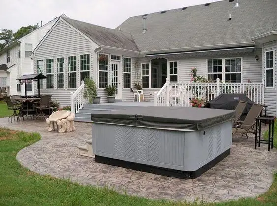 #8. Stamped concrete patio with hot tub