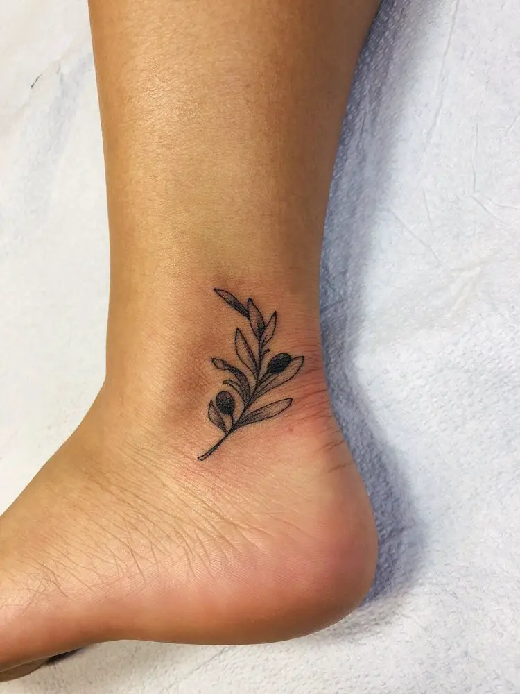 #6. The ankle olive branch tattoo.