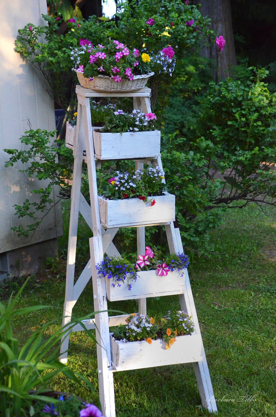 31-32. Rustic ladder flower planter