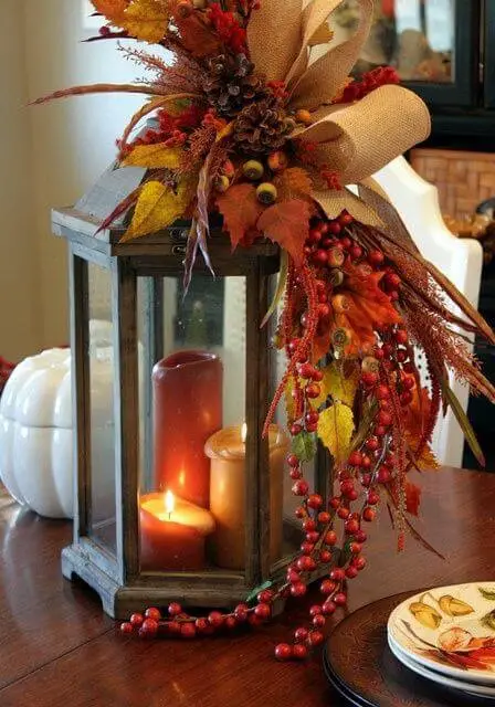 Fall themed centerpiece with candles and leaves