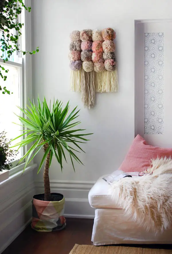 #24. Pom pom wall hanging