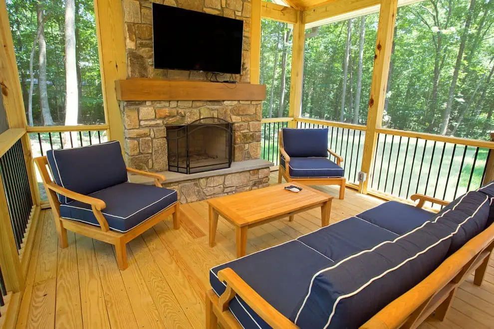 Screened in porch with fireplace and TV ideas.