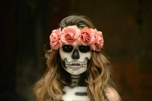 Girl with makeup for catrina halloween with flowers