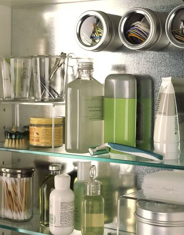 Use magnetic spill bottles to store small things in the bathroom