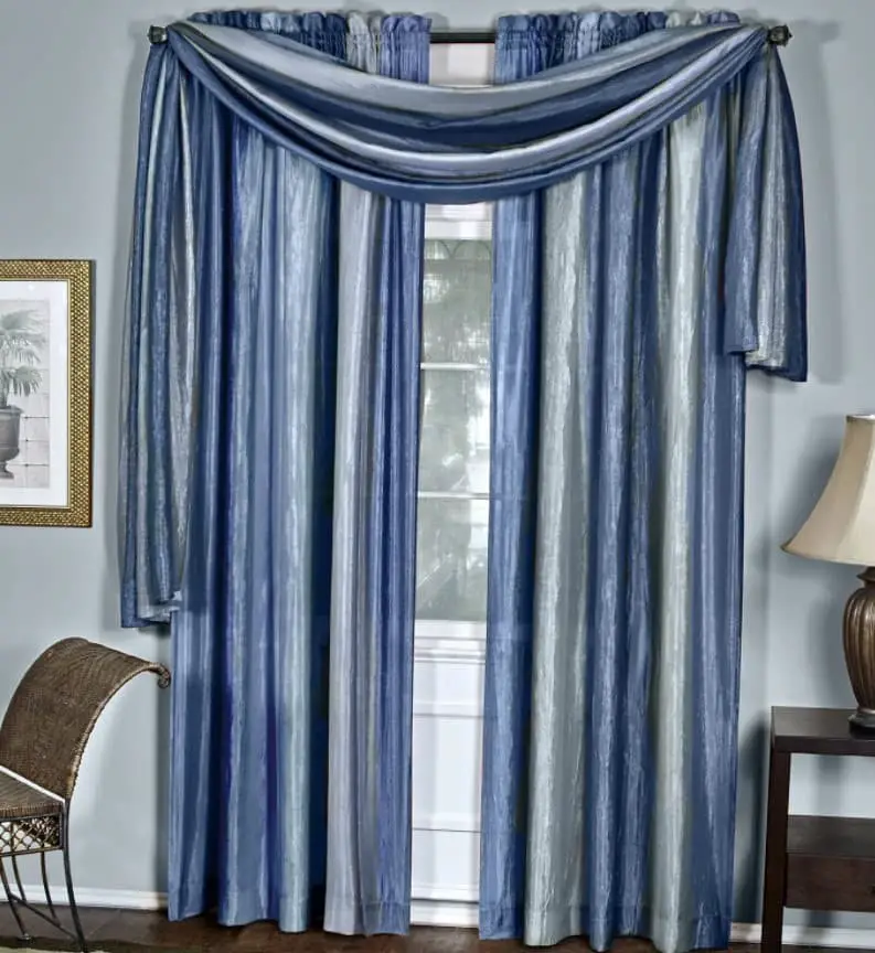 Striped blue curtains on sky blue walls