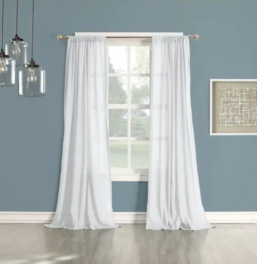 Navy blue wall and white curtains