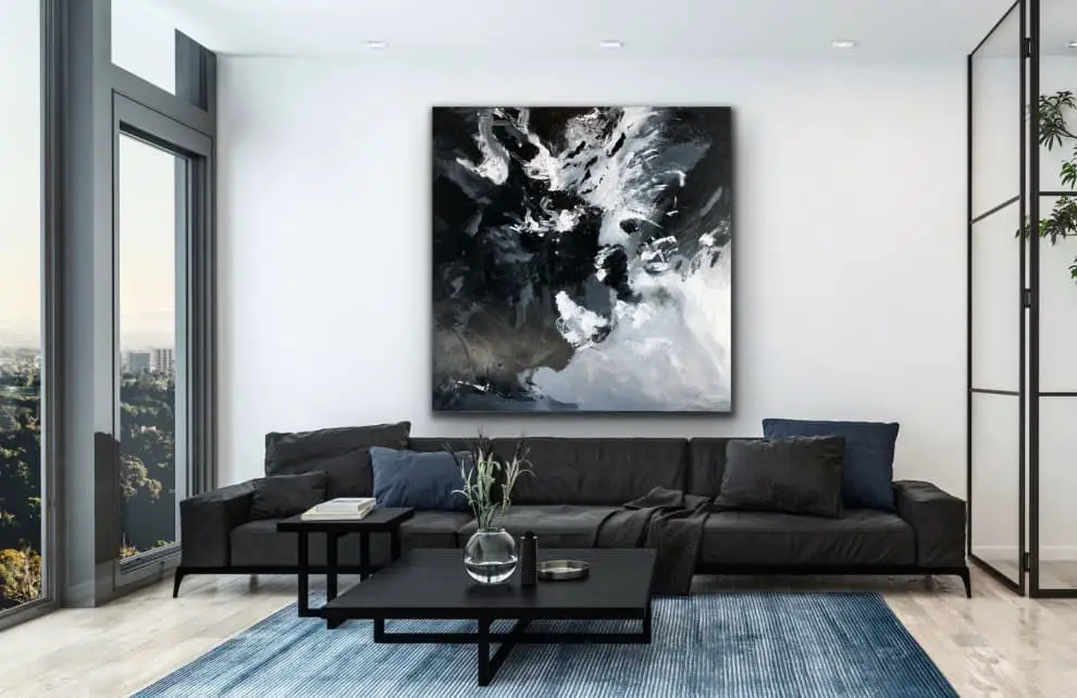 Hang a black and white abstract painting on the wall to add some interest