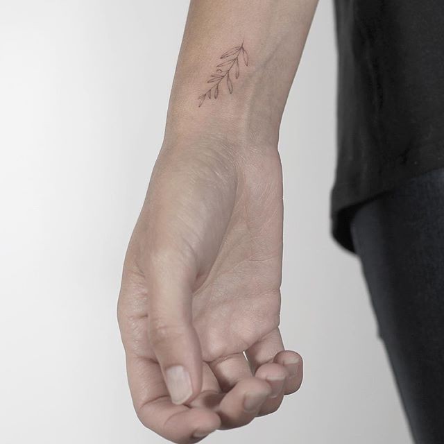 #4. The wrist olive branch tattoo.