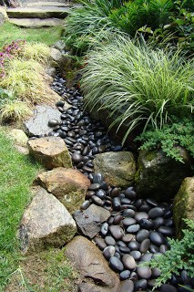 #2. Small backyard with black rocks