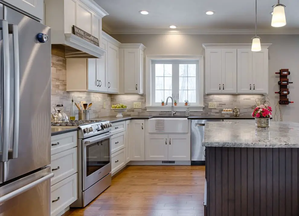 Silver appliances + White cabinets.