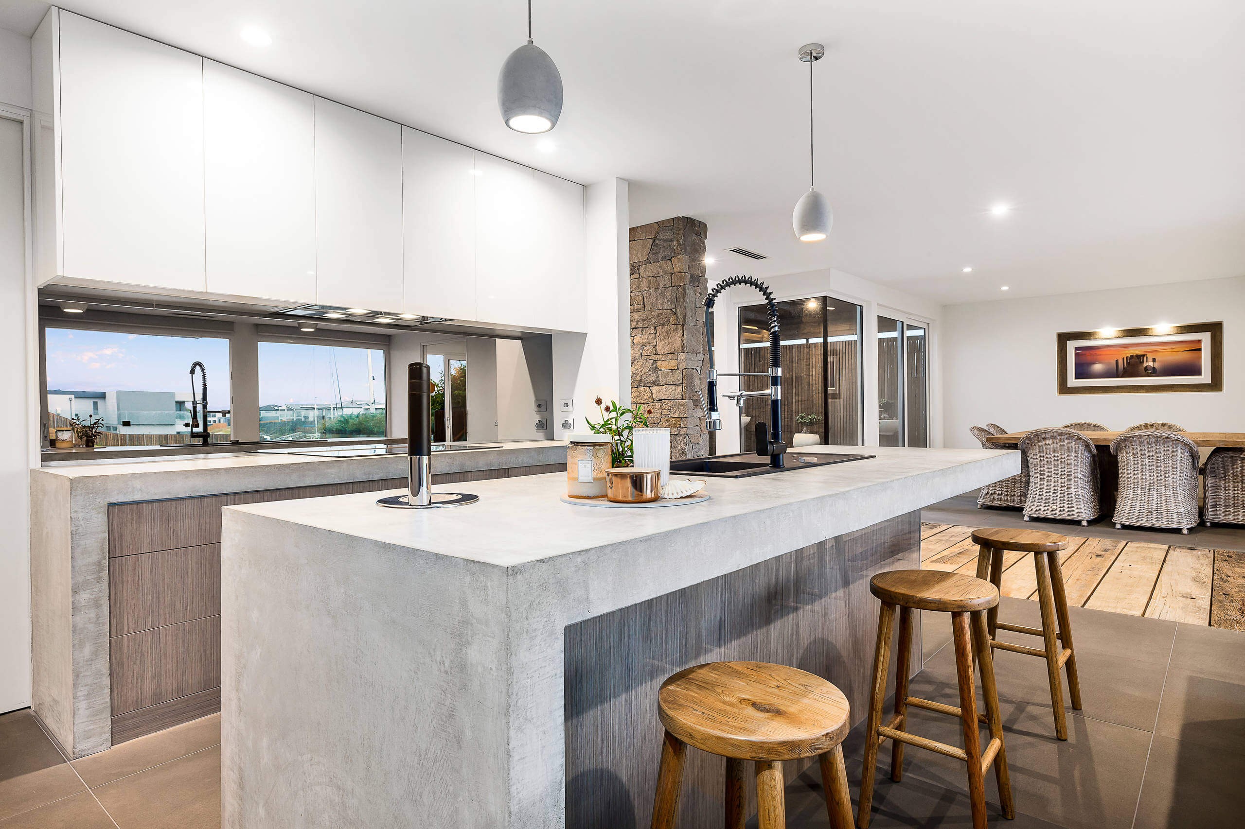 #1. Mid-sized trendy limestone floor and gray floor open concept kitchen design