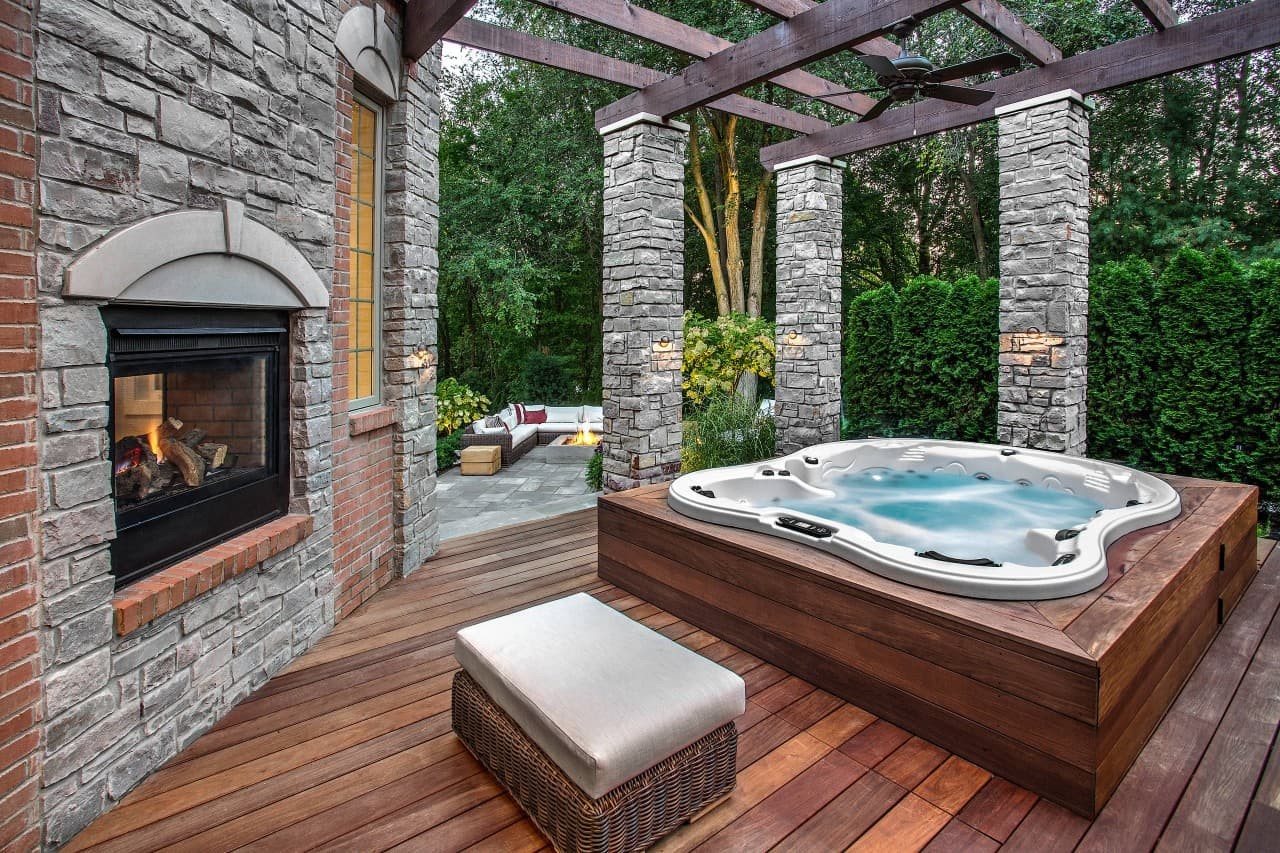 A brick deck on a wood hut tub