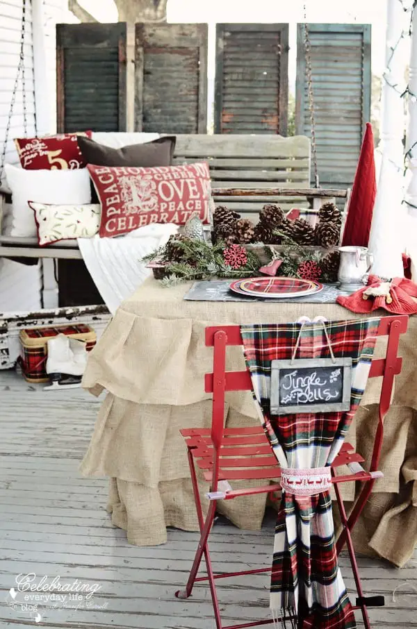 A porch swing with lots of pillows